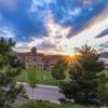 Sun peeking over campus views