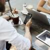 Man checks email on mobile device