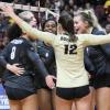 CU women's volleyball team celebrates at a match