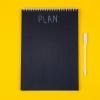 Small chalkboard image with the word "plan." (Unsplash/Volodymyr Hryshchenko)