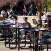Students catch up on studying and relaxing at the UMC fountain area