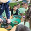 Kids watch as employee demonstrates during Water Festival