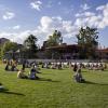 Students sit on Farrand Field lawn to watch a concert