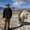 Assistant Professor William Taylor and a horse