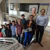 Sarah Withee holding CubeSat with CU Engineering class in spring 2018