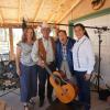 Susan Thomas and Xóchitl Chávez with musicians Sam Medina and Gilbert Medina. 