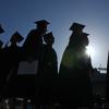 Graduates walk to place on Folsom Field