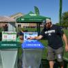 A person recycling a can at CU Boulder