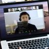 A person using Zoom on a laptop