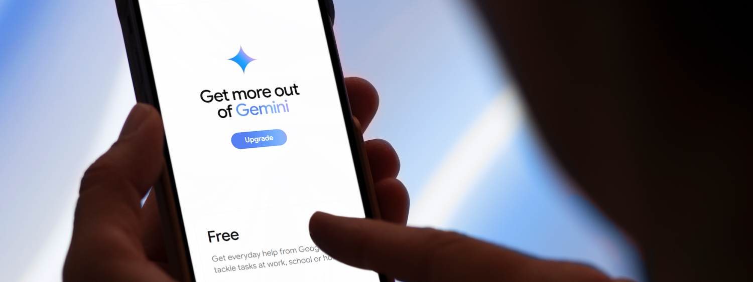 Finger touches a smartphone, with the screen reading: "Get more out of Gemini"