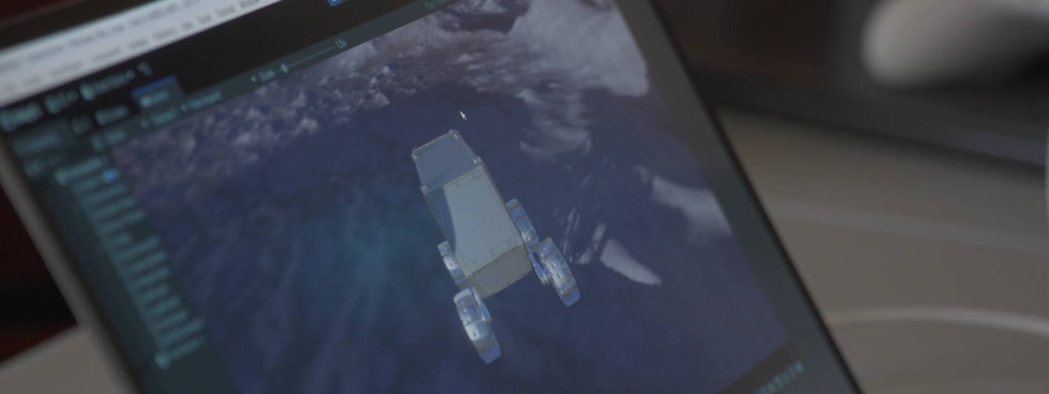Laptop screen displaying an image of a rover on the moon