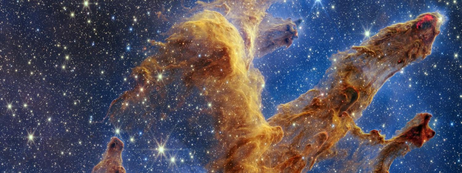 Image of a nebula in space with pillar-like clouds