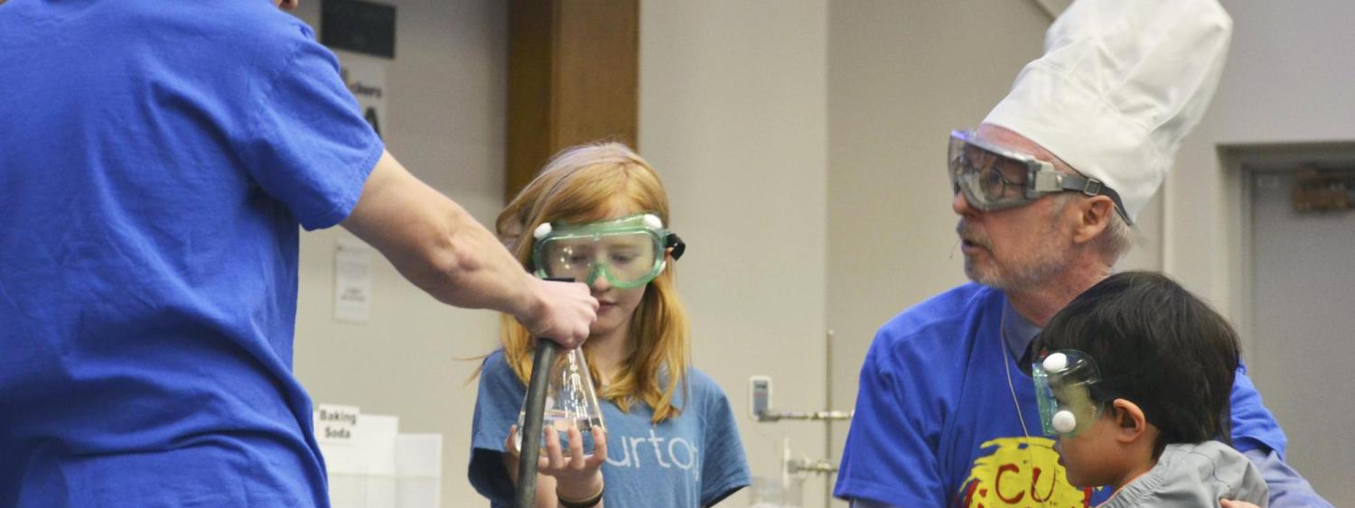 Professor David Nesbitt and participants demonstrate the chemistry of cooking