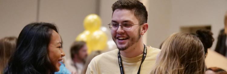 Three students talking at a transfer event