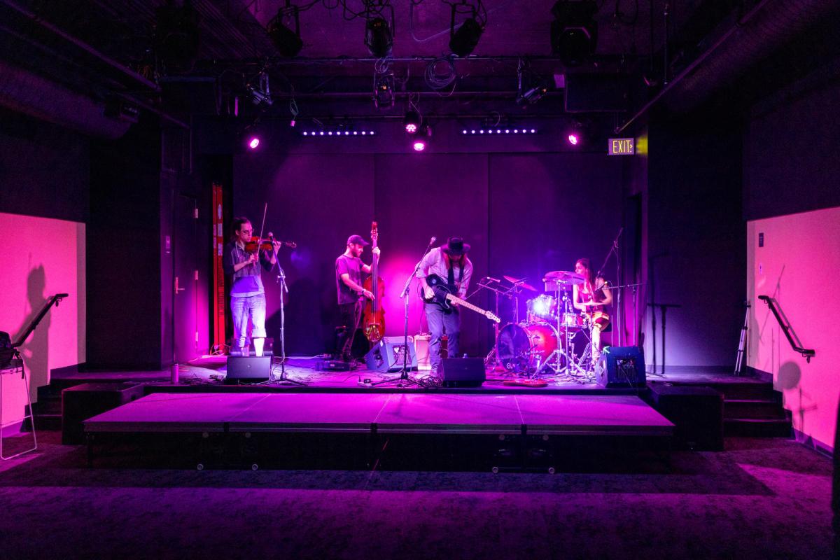band on the stage at Club 156
