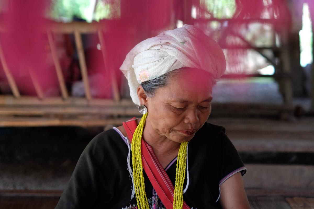 A photo of a woman wearing colorful scarves