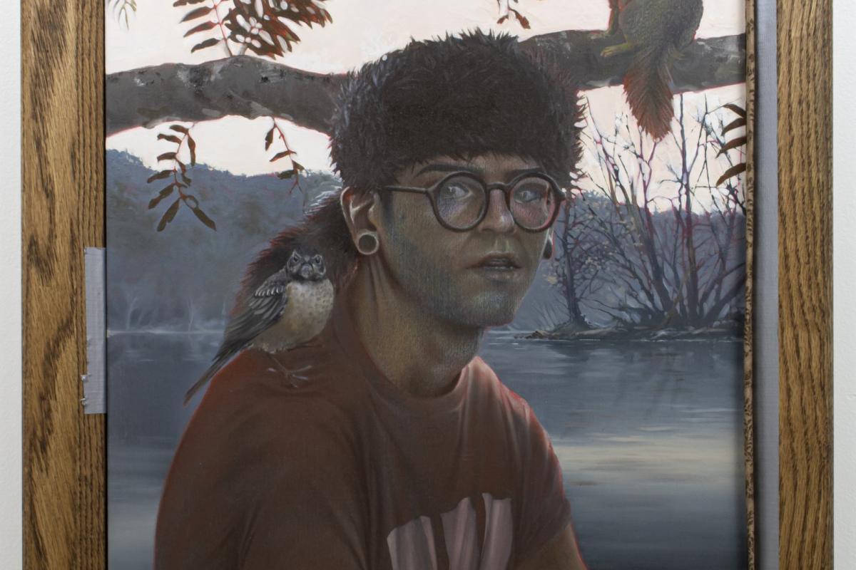 A painting of a young main in a raccoon-skin hat with a squirrel on his shoulder