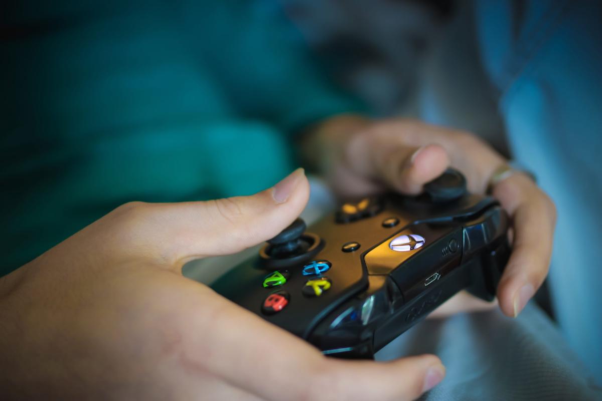 Hands holding a video game controller