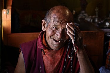 A photo of an Indian man laughing