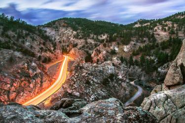 A time-lapse photo of Highway 119, surrounded by mountains