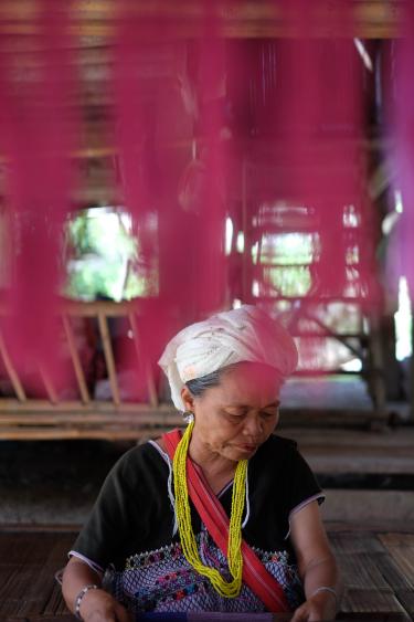 A photo of a woman wearing colorful scarves