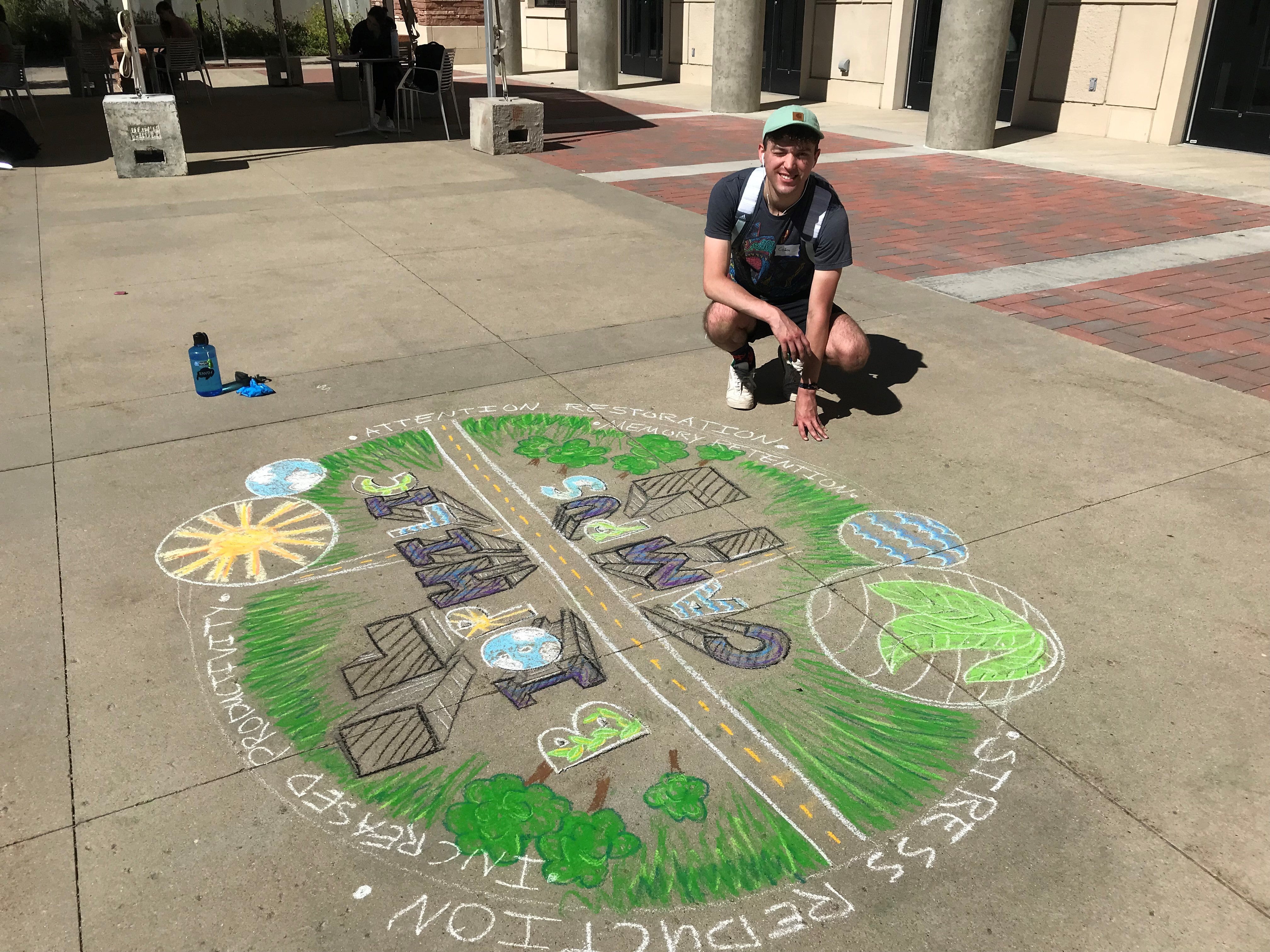 Student creating chalk art