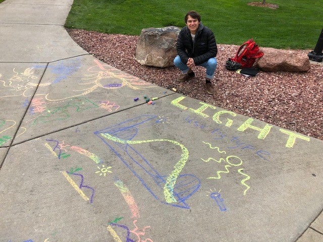Student creating chalk art