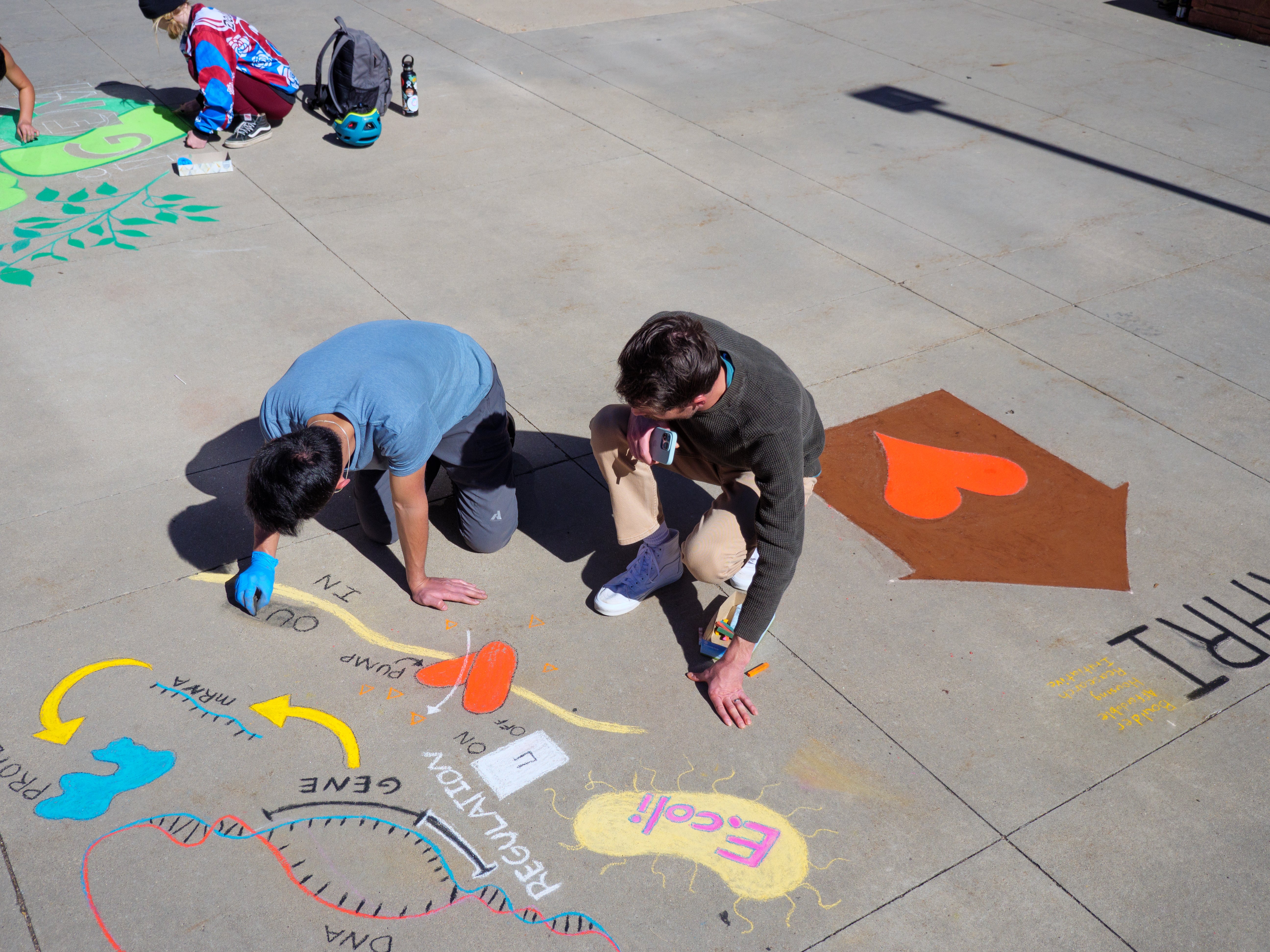 Student creating chalk art