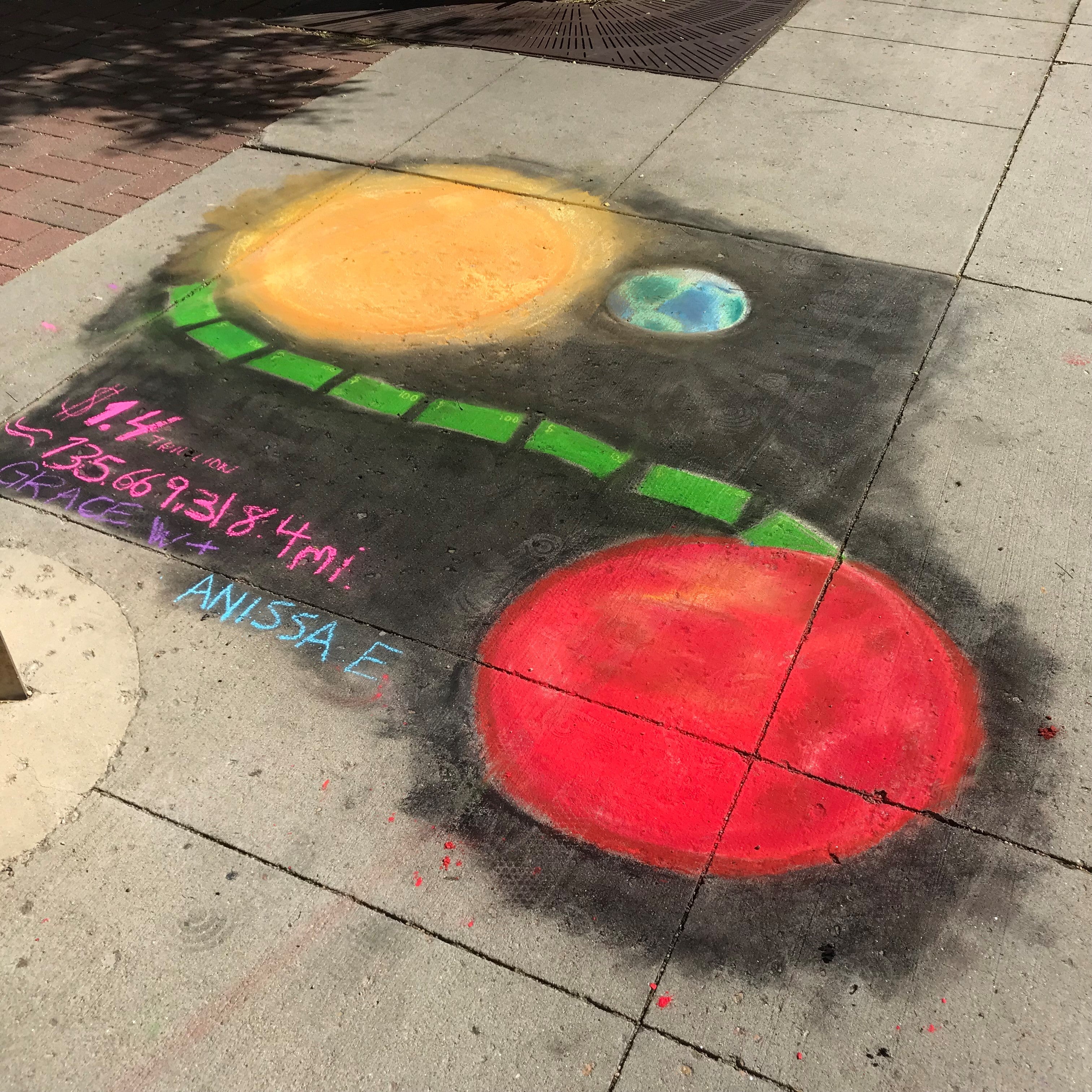 Student creating chalk art