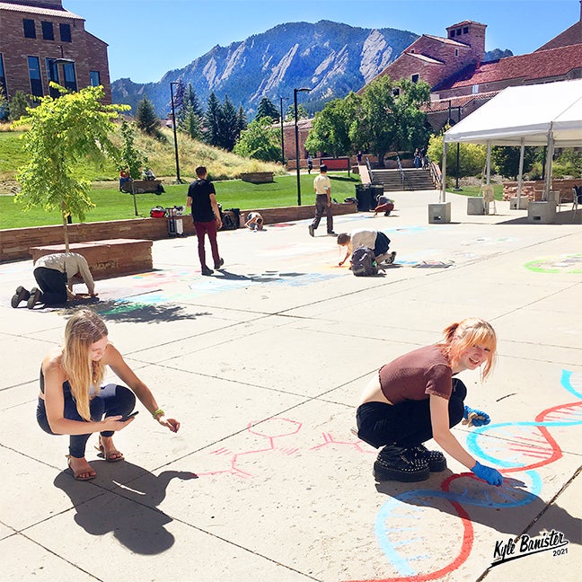 Student creating chalk art