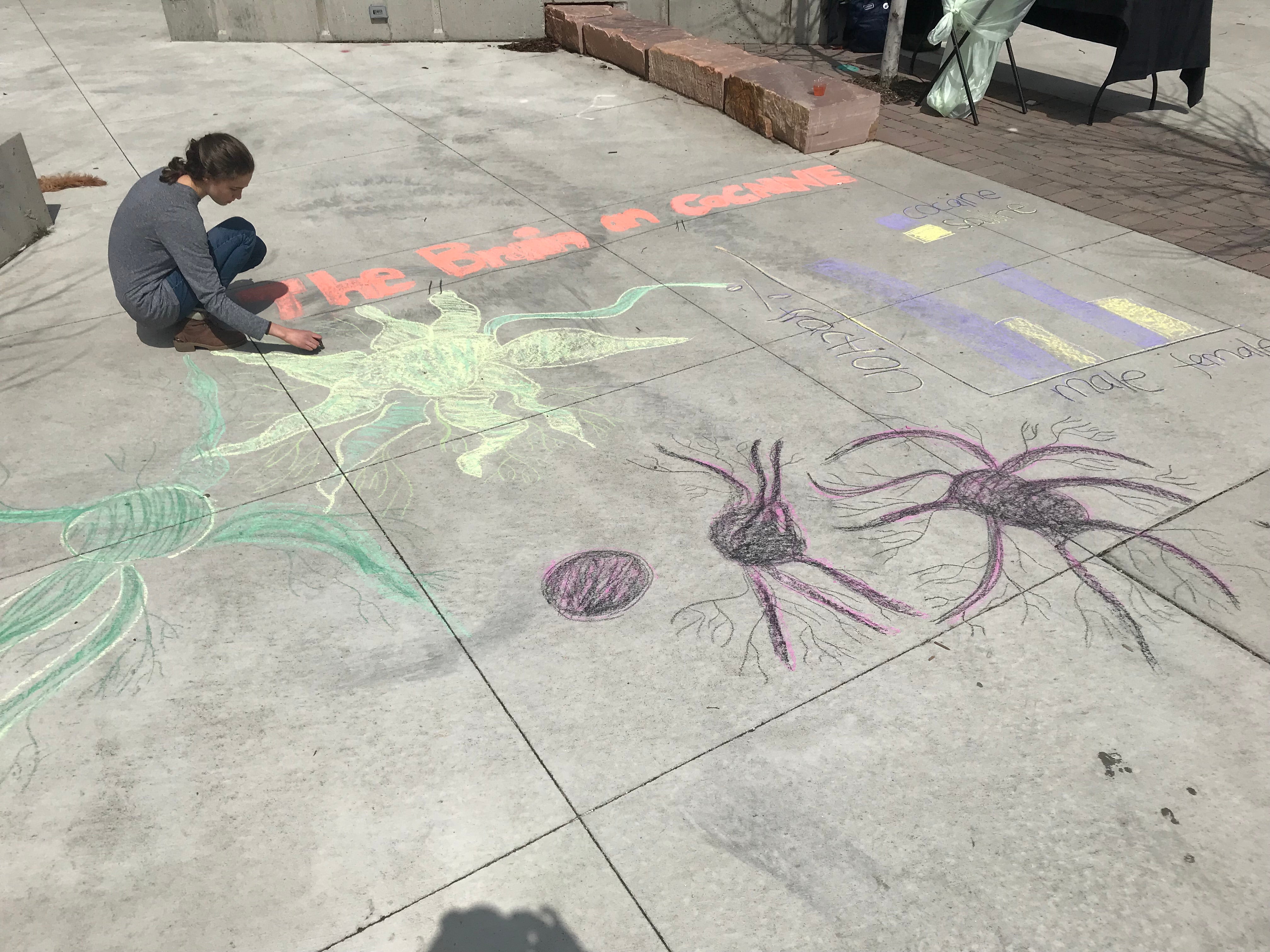 Student creating chalk art