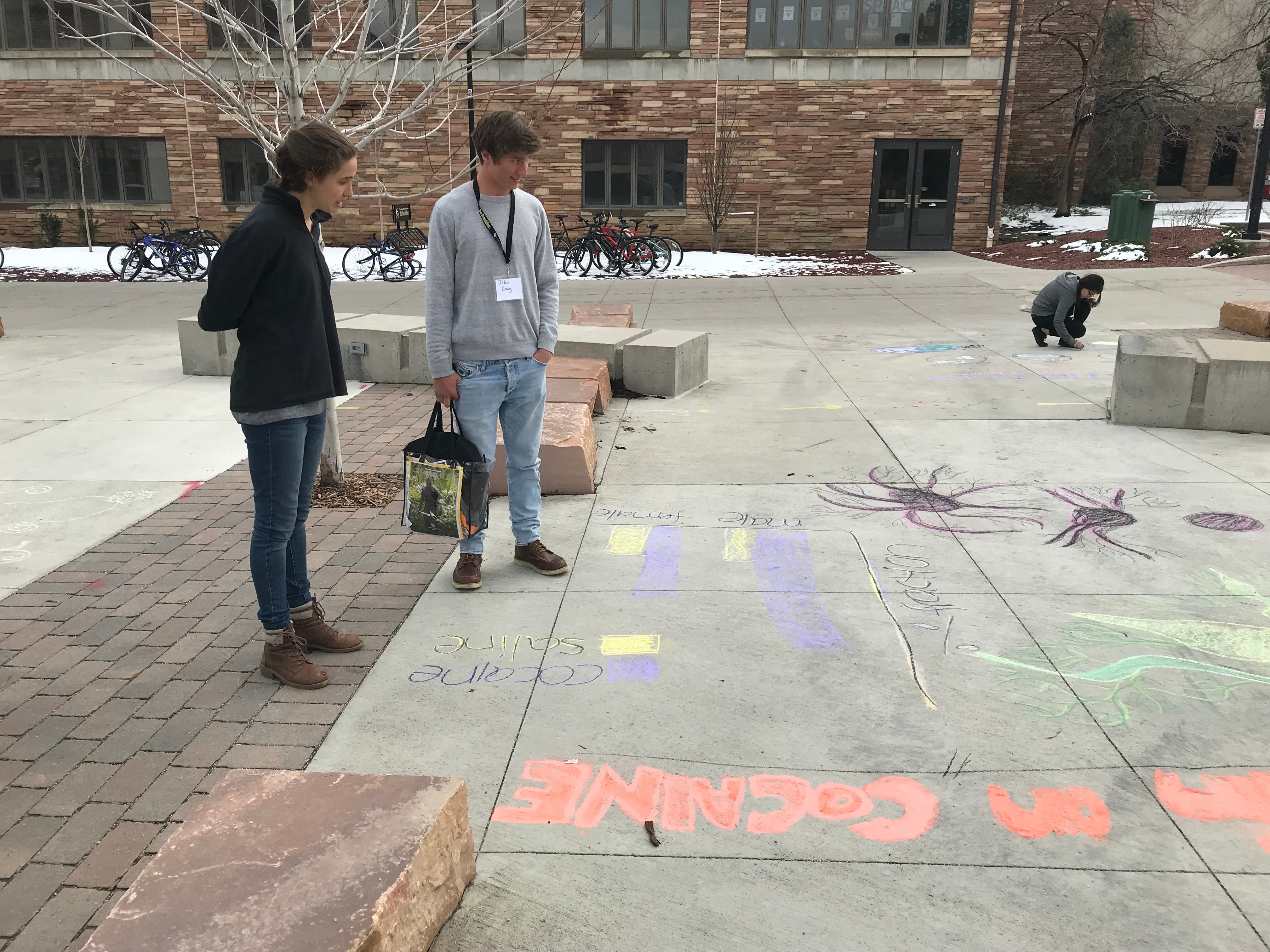 Student creating chalk art