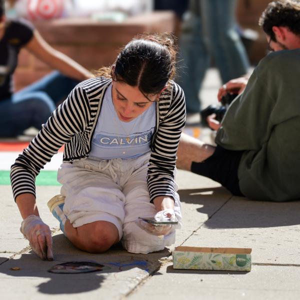 Student creating chalk art