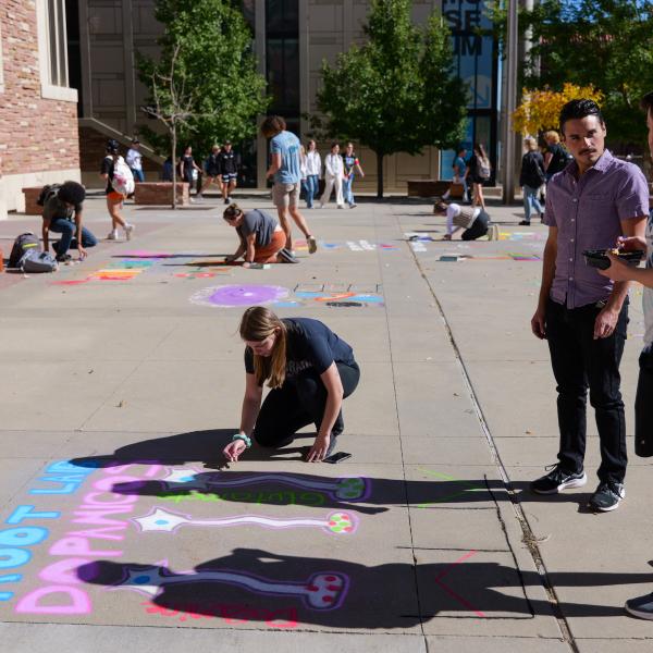 Student creating chalk art
