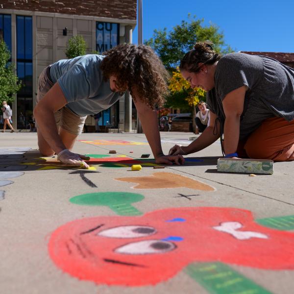Student creating chalk art