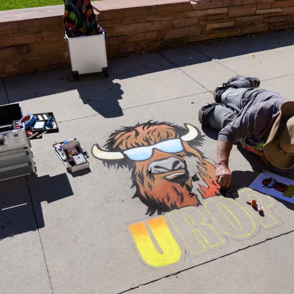 Student creating chalk art