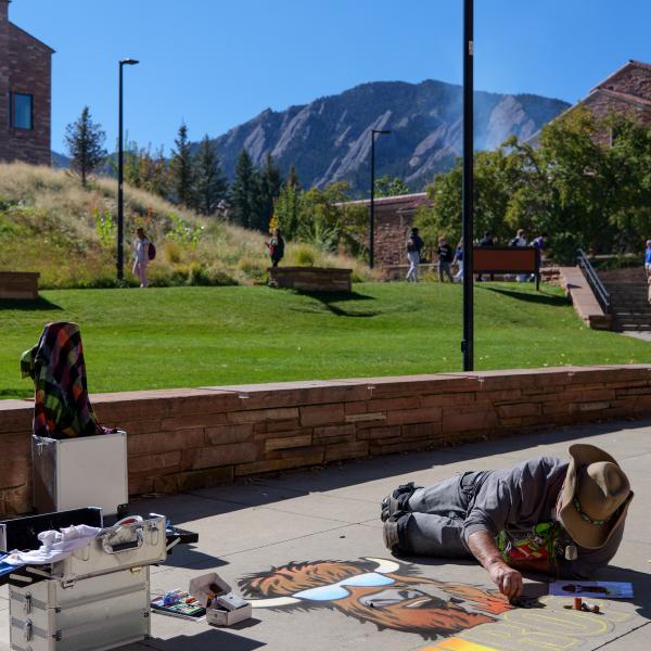 Student creating chalk art