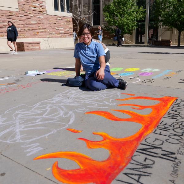 Student creating chalk art