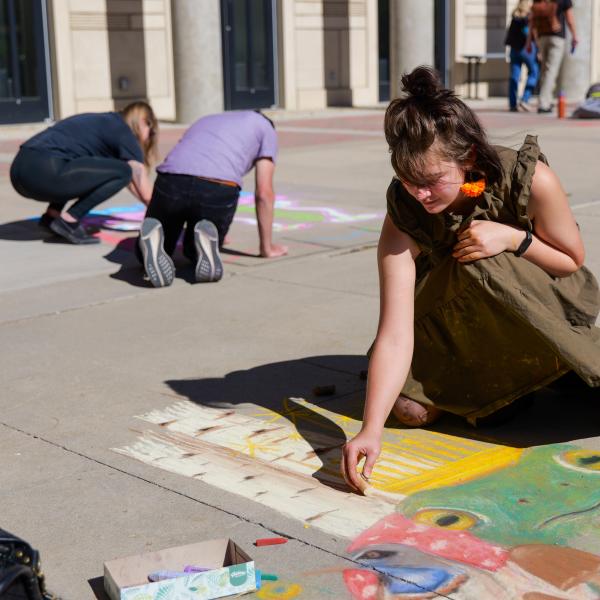 Student creating chalk art