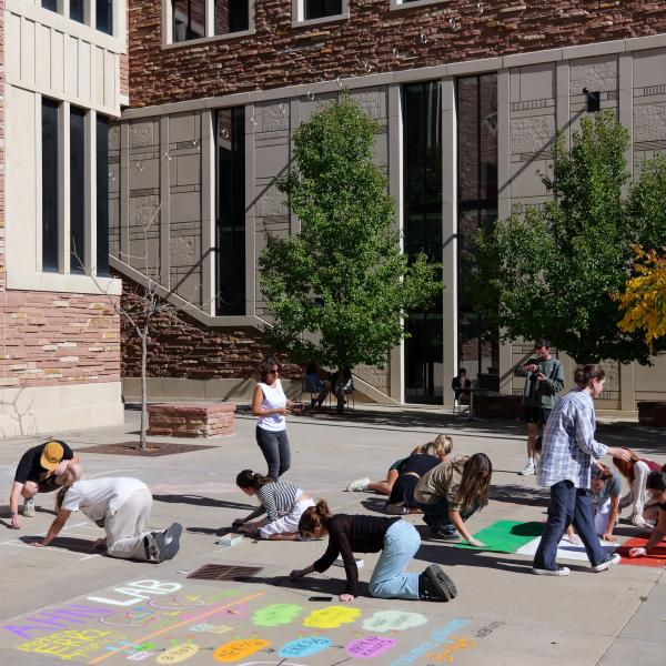 Student creating chalk art