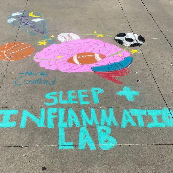 Student creating chalk art