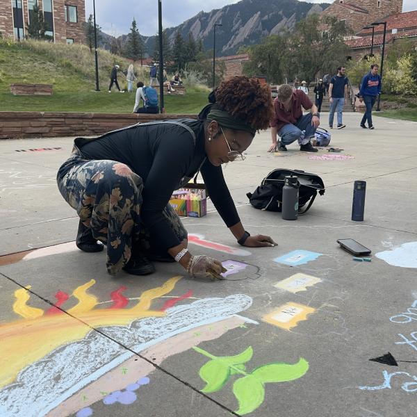 Student creating chalk art