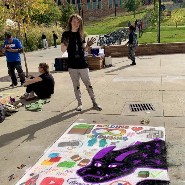 Student creating chalk art