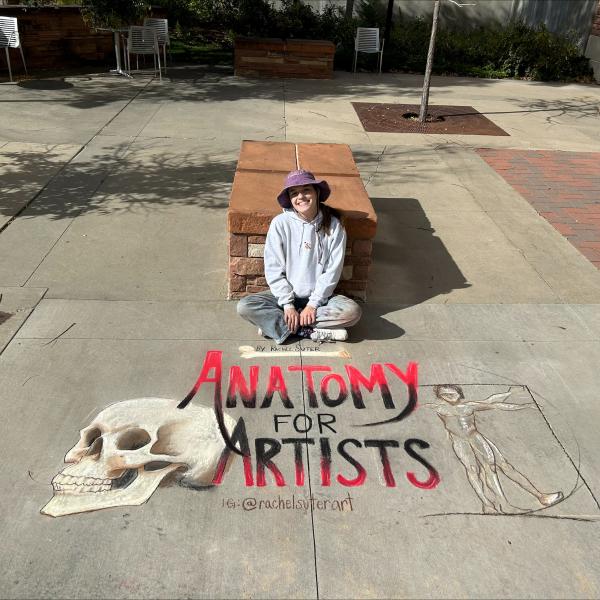 Student creating chalk art