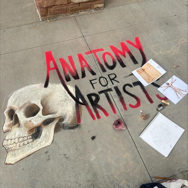 Student creating chalk art