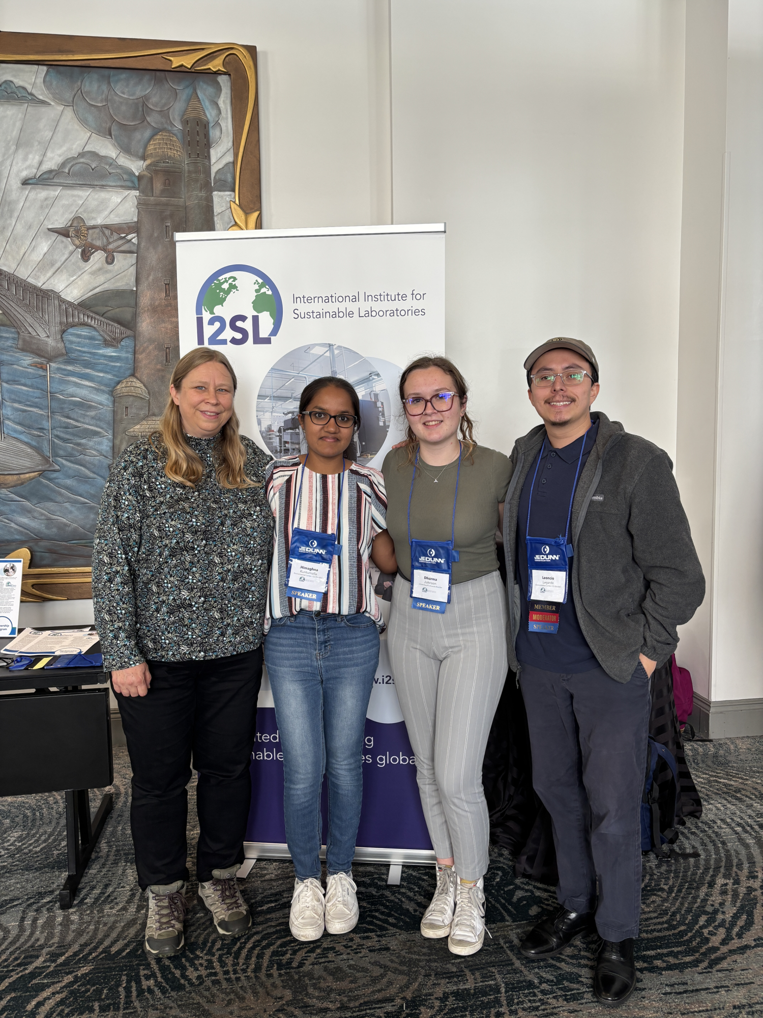 Students posing with mentor and team members