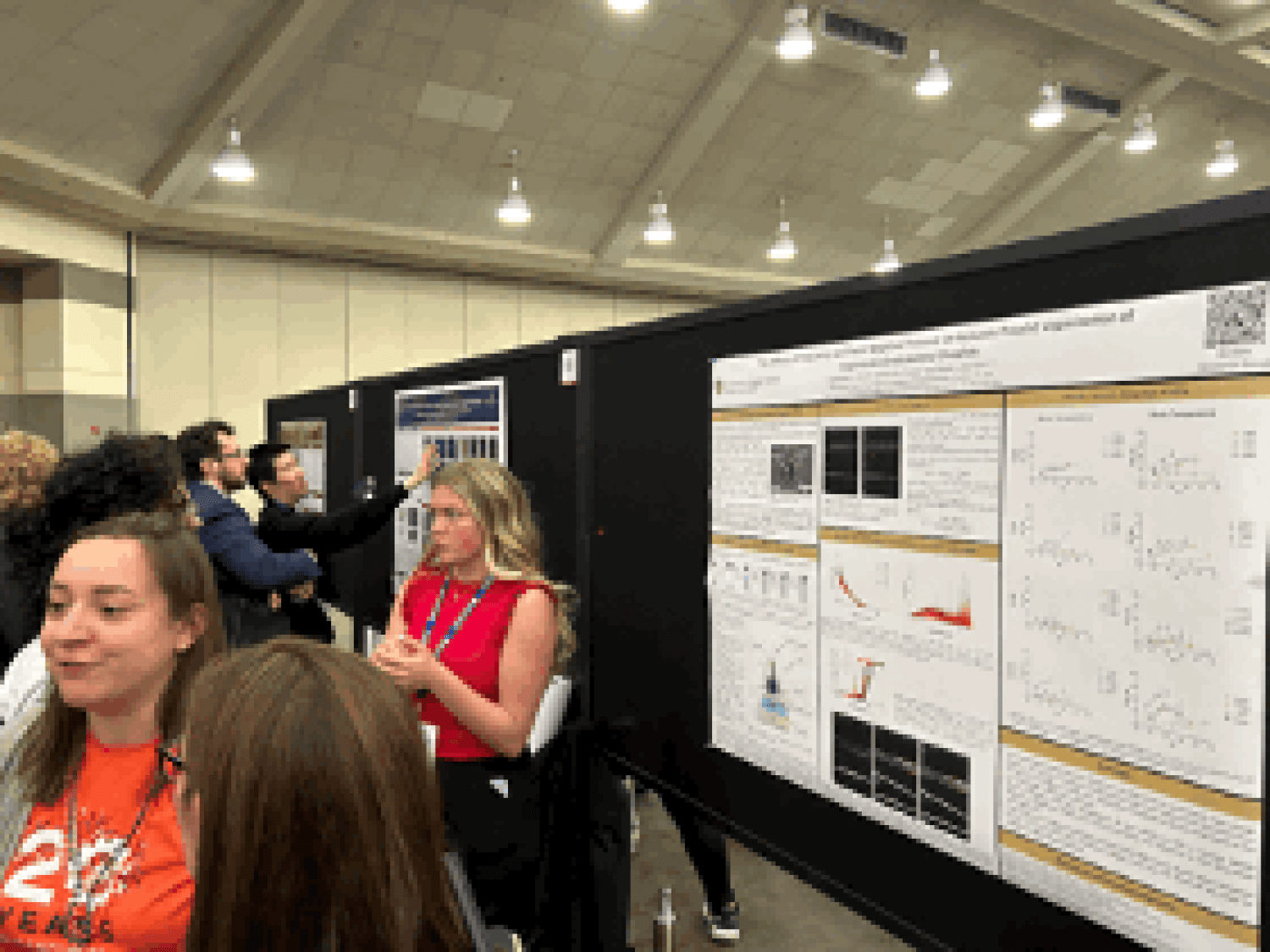 Student delivering their poster presentation