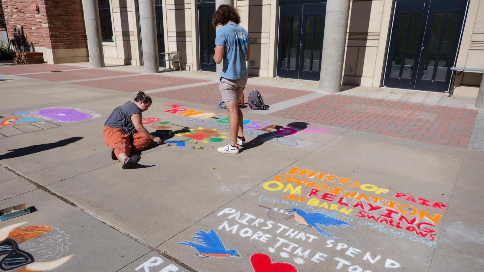 students creating chalk art