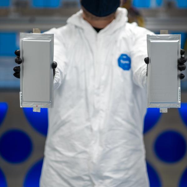 Scientist holds up batteries