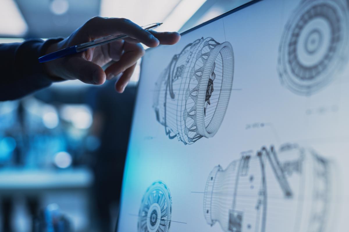 Closeup of a screen showing designs of a jet engine.